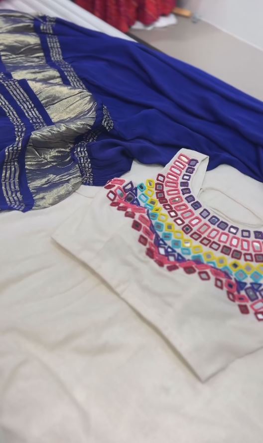 Gorgeous White Mirror Work Navratri Lehenga Choli With Blue Dupatta