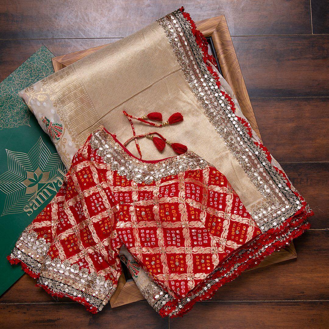 Off White Rich Pallu Saree With Red Bandhani Blouse